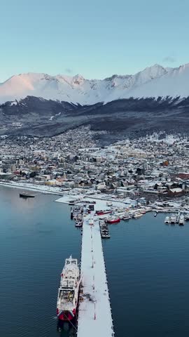 Snow Capped City At Ushuaia In Tierra Del Fuego Argentina. Snow Capped Mountain. Tourism Landmark. Nature Landscape. Snow Capped City At Ushuaia In Tierra Del Fuego Argentina.