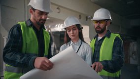 Caucasian team colleagues builders discuss blueprint building in construction guys foremen supervisors controlling industrial project draft site paper woman architects manufacturing handymen talking - Powered by Shutterstock - Get 15% off with code: PIKWIZARD15