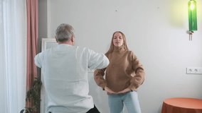 Adult daughter teaching her elderly father doing yoga tree pose with raised arms. Wellness at home, family support, senior fitness, intergenerational bonding, healthy lifestyle, active seniors - Powered by Shutterstock - Get 15% off with code: PIKWIZARD15