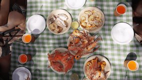 Happy Asian man and woman travel the sea on summer beach holiday vacation. Group of People friends enjoy and fun outdoor lifestyle meeting party eating seafood together on tropical island beach. - Powered by Shutterstock - Get 15% off with code: PIKWIZARD15