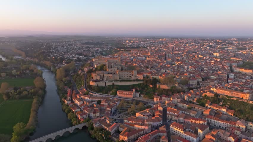 Aerial view of Saint Nazaire Cathedral rising above Beziers rooftops, France