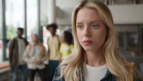 Caucasian girl suffering with lonely stressed woman girl student grief in university high school college bullying by multiracial students diversity classmates bully mock up education problem mockery - Powered by Shutterstock - Get 15% off with code: PIKWIZARD15