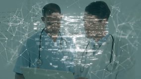 Medical professionals tapping tablet and generating overlay with padlock icon securing patient data. Healthcare, security, technology, collaboration, innovation, professionalism, digital - Powered by Shutterstock - Get 15% off with code: PIKWIZARD15