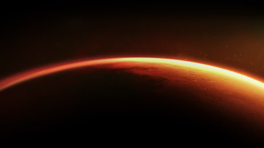 Sunrise illuminating the surface of planet Mars in space