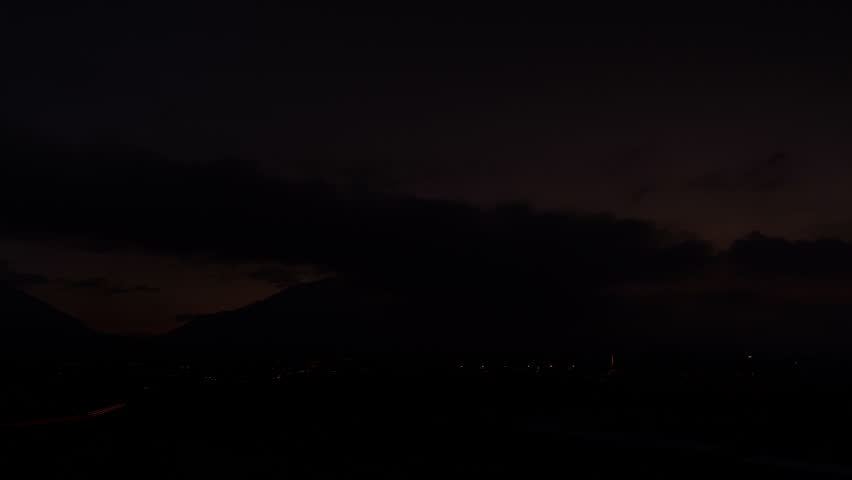 Stunning Salt Lake City view as clouds gather over the mountains at dusk