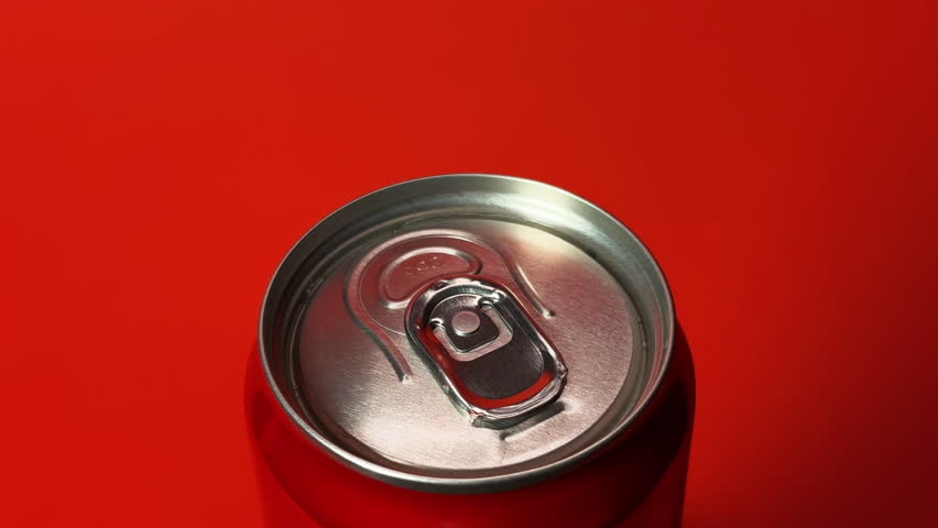 Red Soda Can Spinning 360 with Droplets on Red Background