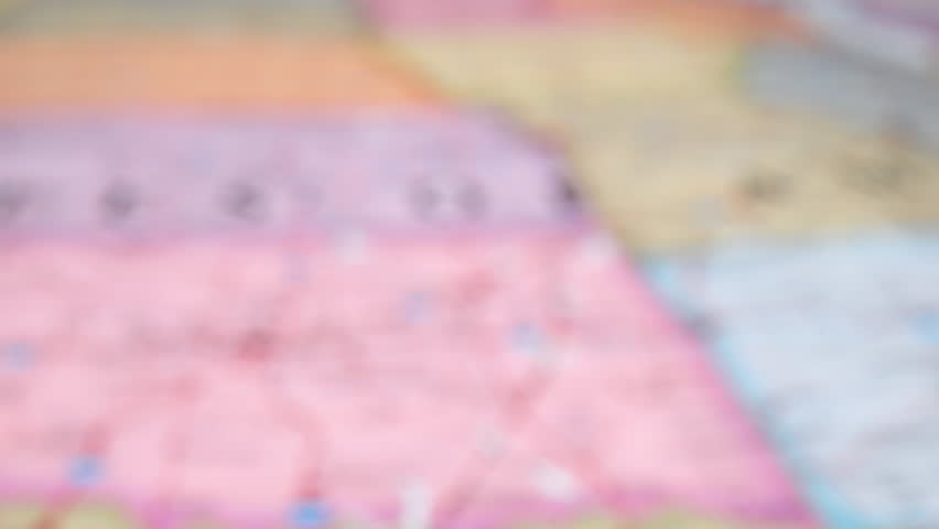 Closeup Of Fabric Map Showing Tulsa, Oklahoma And Nearby Cities. zoom-in shot, racking focus