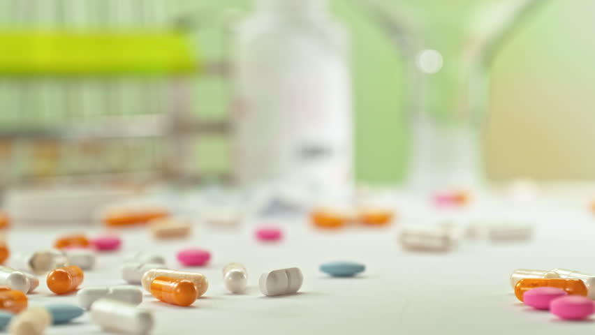 Super Slow Motion of Falling Medicine Dose with Various Pills at 1000fps. Pharmacy concept.