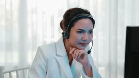 Businesswoman wearing headset working in office to support remote customer or colleague. Frustrated and tired call center customer support agent facing problem on providing vivancy service - Powered by Shutterstock - Get 15% off with code: PIKWIZARD15