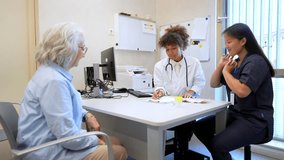 Doctor and nurse interacting with elderly patient, providing medical consultation and care in a hospital setting - Powered by Shutterstock - Get 15% off with code: PIKWIZARD15