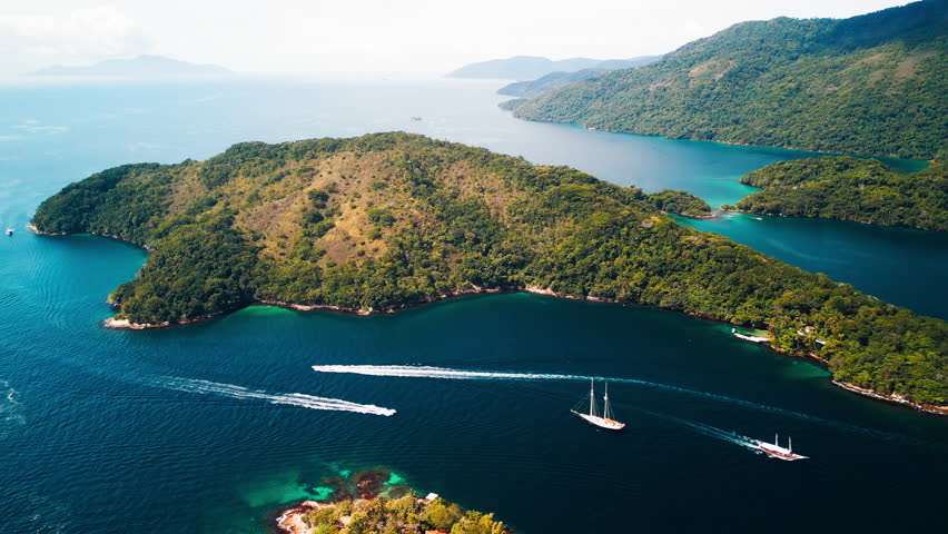 Tropical islands with boats moving around. Area of the island of Ilha Grande in the state of Rio de Janeiro, Brazil