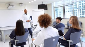 Diverse medical students attentively listening to an instructor in a bright, modern classroom setting, highlighting educational engagement and learning - Powered by Shutterstock - Get 15% off with code: PIKWIZARD15
