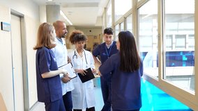 Doctors and nurses sharing updates on patient conditions, fostering teamwork and collaboration in healthcare setting - Powered by Shutterstock - Get 15% off with code: PIKWIZARD15