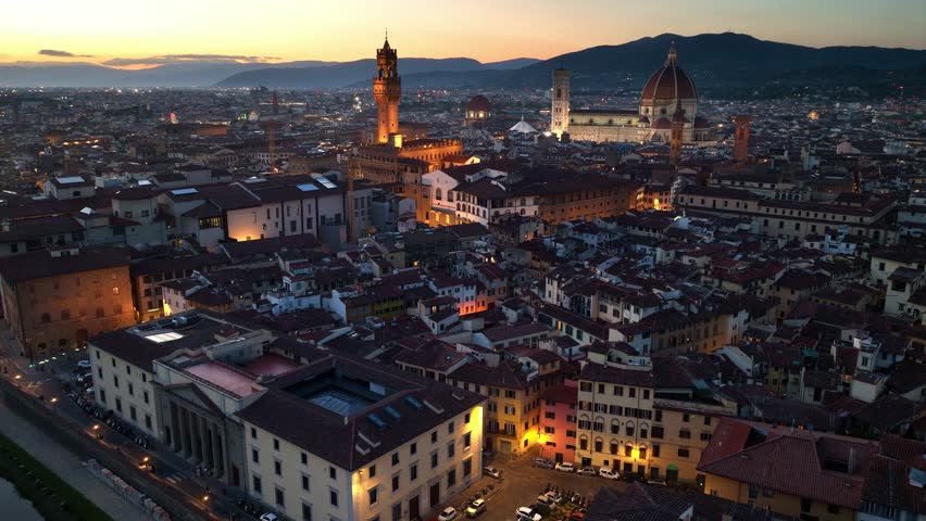 night aerial view of Florence with Florence cathedral, Italian Renaissance architecture, iconic drone shot of Florence. High quality 4k footage