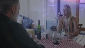 Couple eating and chatting over tablecloth, as glowing tech nodes and HUD graphics enveloping scene. Romantic, dinner, technology, futuristic, connection, ambiance, intimacy - Powered by Shutterstock - Get 15% off with code: PIKWIZARD15