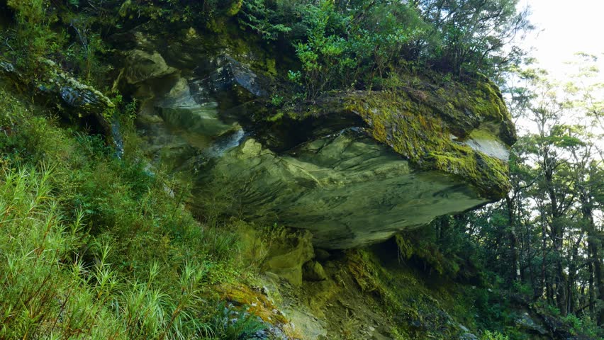 hiker notices dramatic rock overhang and runs fast to avoid it