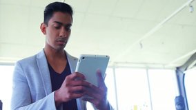 Businessman tapping and swiping tablet at tech desk, exploring user add and bell icons enlarging. Technology, connectivity, innovation, digital, communication, networking, modern - Powered by Shutterstock - Get 15% off with code: PIKWIZARD15