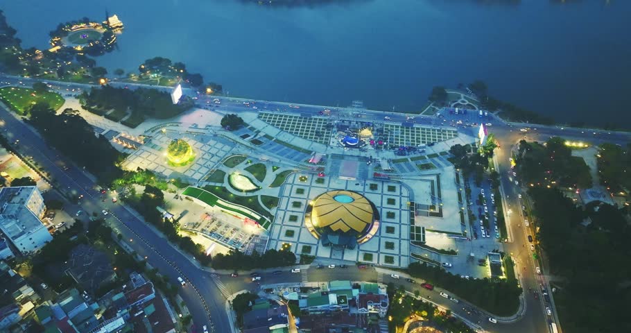Aerial view of Sunflower Building at night in Da Lat City. Tourist city in developed Vietnam. Center Square of Da Lat city with Xuan Huong lake.