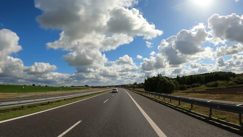 the car is driving at high speed on the motorway