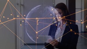 Businesswoman entering corridor using tablet animating rotating globe with pulsing nodes and code. Technology, innovation, connectivity, digital, corporate, data, communication - Powered by Shutterstock - Get 15% off with code: PIKWIZARD15