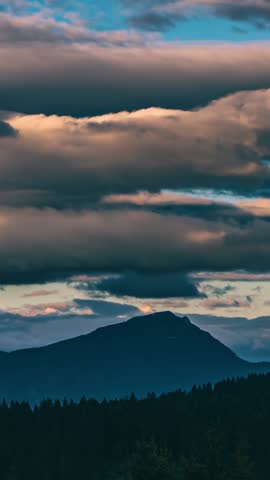 Dramatic Clouds Sky Over Alpine Forest Mountains, Vertical Nature Time Lapse