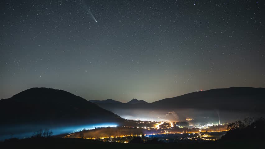 Comet Tsuchinshan Atlas and Milky Way Galaxy Stars over Rural Landscape in Starry Night Sky Time Lapse