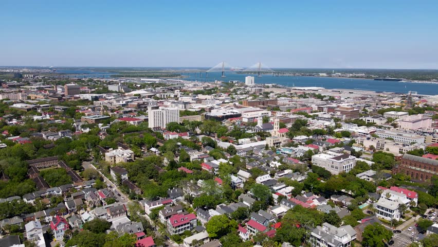 Charleston South Carolina Colonial Lake Park with Cooper River Bridge in background dolly forward shot