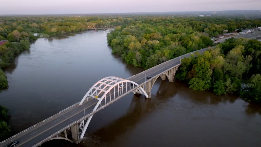 Edmund Pettus Bridge in Selma, Alabama at dusk with drone video moving in a circle.