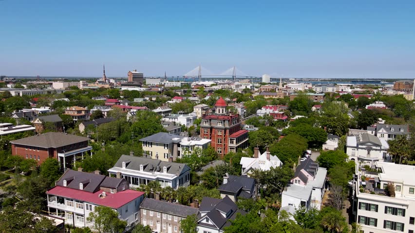 Charleston South Carolina Colonial Lake Park with Cooper River Bridge in background dolly forward shot