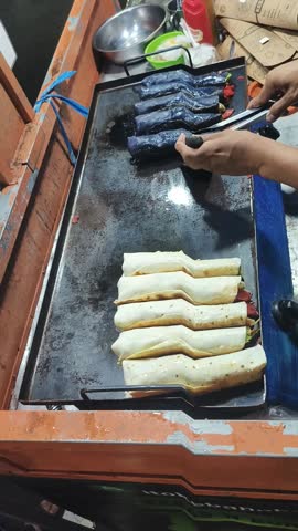 making kebabs in street food with beef and chicken toppings