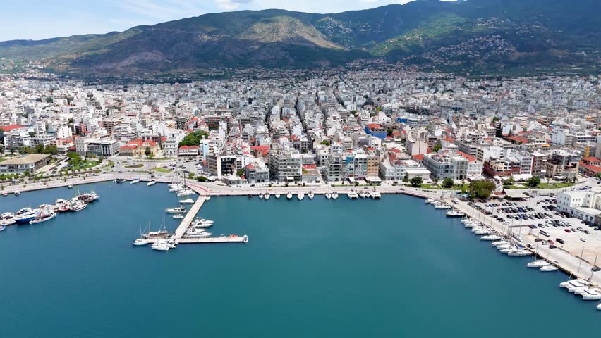 Panoramic aerial view of the skyline of Volos, Greece, with new port and marina, ferry terminal and waterfront promenade