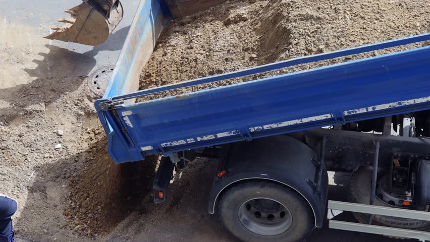 Aerial View of Dump Truck Sand Gravel Dumping Road Construction Work