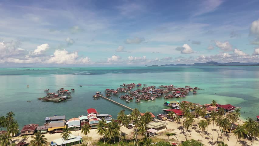 Aerial footage of Borneo Sea Gypsy water village at Omadal island, Semporna Sabah, Malaysia.