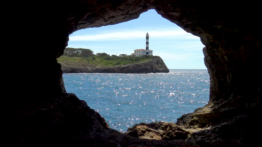 Light house of Felanitx viewed fron the natural Cave of Foradada, in the West side of Mallorca Island, Spain.