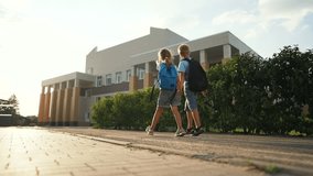 Happy family concept. portrait of children going to school. children with backpacks run on way to school. students go together to receive an education. children's dream. students smiling holding hands - Powered by Shutterstock - Get 15% off with code: PIKWIZARD15