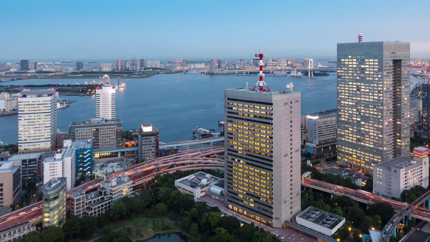 Night time lapse of Tokyo Japan and Tokyo Bay. With Odaiba in the background.