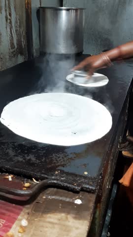Dosa making, traditional south indian food,  hotel food, rice batter,Tamilnadu, India, asia 