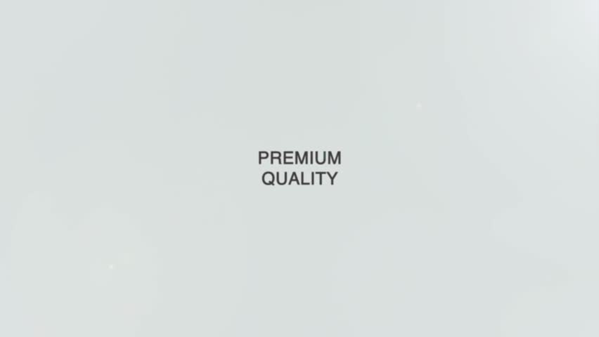 A hand holds a magnifying glass focusing on the words “Premium Quality” on a clean white background, symbolizing excellence, high standards, and careful attention to superior products or services