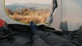 View from inside a tent overlooking a stunning mountain landscape. Peaceful nature scene, serene and remote, perfect for camping, adventure, and outdoor relaxation. - Powered by Shutterstock - Get 15% off with code: PIKWIZARD15