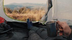 View from inside a tent overlooking a stunning mountain landscape. Peaceful nature scene, serene and remote, perfect for camping, adventure, and outdoor relaxation. - Powered by Shutterstock - Get 15% off with code: PIKWIZARD15