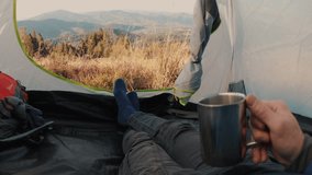View from inside a tent overlooking a stunning mountain landscape. Peaceful nature scene, serene and remote, perfect for camping, adventure, and outdoor relaxation. - Powered by Shutterstock - Get 15% off with code: PIKWIZARD15
