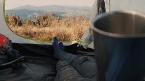 View from inside a tent overlooking a stunning mountain landscape. Peaceful nature scene, serene and remote, perfect for camping, adventure, and outdoor relaxation. - Powered by Shutterstock - Get 15% off with code: PIKWIZARD15