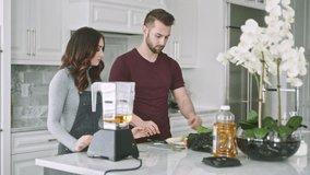 Couple prepares healthy smoothie with fresh ingredients in modern kitchen - Powered by Shutterstock - Get 15% off with code: PIKWIZARD15