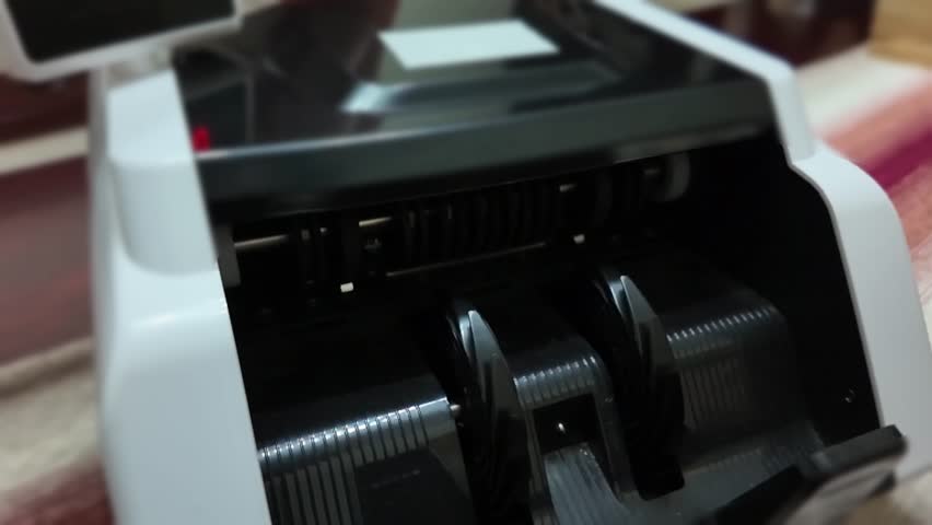 Slow motion of bill counting machine - Chinese Renminbi - RMB - Chinese Yuan - CNY