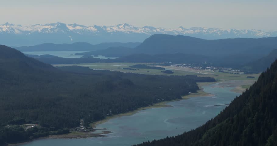 Juneau, Alaska.Beautiful view from Mount Roberts over the Gastineau channel and Juneau airport.Chilkat Mountain Range in the background.
