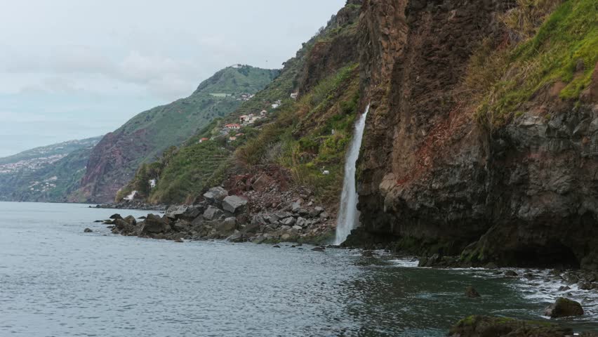 Ponta do Sol Madiera aerial landscape with waterfall cascading into the sea