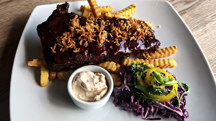 BBQ prime ribs sauce caramelised onions side salad radish sauce american dish cuisine