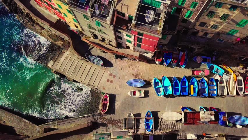 Aerial drone view of Cinque terre coast in Italy, Italian riviera in Liguria aerial view, fishing village of Riomaggiore, holiday in Cinque Terre, Italy