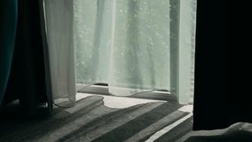 Wind blowing white curtain from open window in hotel. Breeze drifting through open glass and moving sheer drape in sunny interior. Air flowing in from outside and swaying light curtain over soft floor - Powered by Shutterstock - Get 15% off with code: PIKWIZARD15