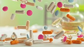 Super Slow Motion of Various Pills Falling in Pharmacy Table at 1000fps. - Powered by Shutterstock - Get 15% off with code: PIKWIZARD15